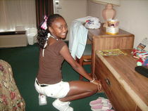 Black girl giving footjob
